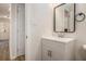 Bathroom with gray vanity, modern mirror, and tile floors at 1627 Isham Dr, Lawrenceville, GA 30046