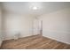 Bright bedroom with hardwood floors, white trim, and a modern ceiling light at 1627 Isham Dr, Lawrenceville, GA 30046