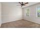 Bedroom with carpet and two windows at 1627 Isham Dr, Lawrenceville, GA 30046