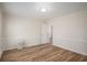 Spacious bedroom featuring hardwood flooring and neutral wall paint at 1627 Isham Dr, Lawrenceville, GA 30046
