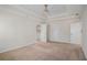 Primary bedroom with trey ceiling, ceiling fan, and multiple doorways at 1627 Isham Dr, Lawrenceville, GA 30046