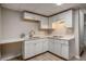 Efficient kitchen space with ample white cabinets, quartz countertops, and modern appliances at 1627 Isham Dr, Lawrenceville, GA 30046