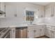 Bright kitchen featuring stainless steel appliances, and white cabinets at 1627 Isham Dr, Lawrenceville, GA 30046