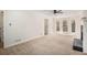 Spacious living room with a fireplace and glass doors to the outside at 1627 Isham Dr, Lawrenceville, GA 30046