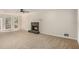 Spacious living room with a fireplace and large windows that allow ample natural light at 1627 Isham Dr, Lawrenceville, GA 30046