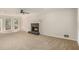 Bright living room with a cozy fireplace and access to the outdoors through French doors at 1627 Isham Dr, Lawrenceville, GA 30046