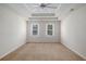 Spacious main bedroom featuring a trey ceiling and ceiling fan at 1627 Isham Dr, Lawrenceville, GA 30046