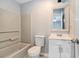 A clean bathroom has a tub with shower, a standard toilet, and a single sink and vanity at 3918 S Creek Ct, Stone Mountain, GA 30083