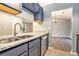Modern kitchen with granite countertops, stainless steel appliances, and blue cabinets at 3918 S Creek Ct, Stone Mountain, GA 30083