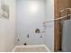 Utility room with water heater, plumbing, tile floor, and electrical outlets at 3918 S Creek Ct, Stone Mountain, GA 30083
