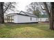 The backyard has a small lawn area with a view of the back of the house at 65 Sage St, Temple, GA 30179