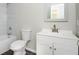 Bathroom featuring a tub and shower, a toilet, vanity and mirror at 65 Sage St, Temple, GA 30179