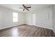 Bedroom featuring wood-look floors, a ceiling fan, one window, and a closet at 65 Sage St, Temple, GA 30179