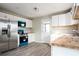 Modern kitchen with stainless steel fridge, wood counters, and colored microwave and stove at 65 Sage St, Temple, GA 30179