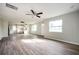 Open-concept living and kitchen area featuring modern flooring and ample natural light at 65 Sage St, Temple, GA 30179