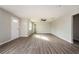 Inviting living room showcasing updated flooring, a ceiling fan, and ample natural light at 65 Sage St, Temple, GA 30179