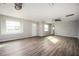 Spacious living room with new vinyl floors, natural light, and ceiling fan at 65 Sage St, Temple, GA 30179