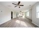 Bright living area with updated flooring seamlessly connecting the living and kitchen spaces at 65 Sage St, Temple, GA 30179