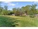 Lush backyard featuring a spacious lawn and mature trees, perfect for outdoor activities and relaxation at 2062 Cezar Nw Dr, Kennesaw, GA 30152