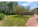 A generous backyard with mature trees offers privacy and space for recreation or relaxation at 2062 Cezar Nw Dr, Kennesaw, GA 30152