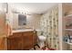 Bathroom features a vanity with storage, a full size mirror, and a shower with tub at 2062 Cezar Nw Dr, Kennesaw, GA 30152