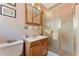 Tiled bathroom featuring a vanity, mirror, and glass shower at 2062 Cezar Nw Dr, Kennesaw, GA 30152