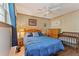 A comfortable bedroom offers a ceiling fan, wood floors, and a coordinating crib at 2062 Cezar Nw Dr, Kennesaw, GA 30152