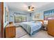 Comfortable bedroom with a ceiling fan and natural light at 2062 Cezar Nw Dr, Kennesaw, GA 30152