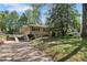 Split-level home featuring a brick driveway and a lush lawn at 2062 Cezar Nw Dr, Kennesaw, GA 30152