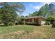 Traditional home with a lush green lawn and mature trees at 2062 Cezar Nw Dr, Kennesaw, GA 30152