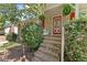 Inviting front porch featuring a red door and decorative plants at 2062 Cezar Nw Dr, Kennesaw, GA 30152