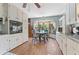 Traditional kitchen with white cabinets, hardwood floors, and breakfast nook at 2062 Cezar Nw Dr, Kennesaw, GA 30152