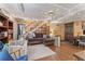 Cozy living area with ceiling fan, built-in shelving and natural light cascading from a nearby window at 2062 Cezar Nw Dr, Kennesaw, GA 30152