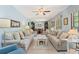 Spacious living room featuring plush sofas and large windows at 2062 Cezar Nw Dr, Kennesaw, GA 30152