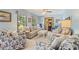Cozy living room showcasing neutral furniture and natural lighting at 2062 Cezar Nw Dr, Kennesaw, GA 30152