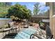 Charming patio area with comfortable seating, grill, and beautiful landscaping for outdoor enjoyment at 2062 Cezar Nw Dr, Kennesaw, GA 30152