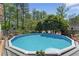 Relaxing pool area with clear water and plenty of surrounding deck space for entertaining at 2062 Cezar Nw Dr, Kennesaw, GA 30152