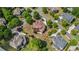 An aerial view showing a collection of homes with well-manicured lawns and mature trees in a residential neighborhood at 2400 Gants Hill Pl, Cumming, GA 30041