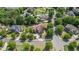 Aerial view showcasing the beautiful home nestled in a tree-lined neighborhood at 2400 Gants Hill Pl, Cumming, GA 30041
