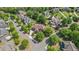 Aerial view showcasing the beautiful home nestled in a tree-lined neighborhood at 2400 Gants Hill Pl, Cumming, GA 30041