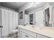 This bathroom features double doors, a toilet and shower, and vanity with sink at 2400 Gants Hill Pl, Cumming, GA 30041