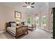 Neutral bedroom with two twin beds, carpet floors and natural light at 2400 Gants Hill Pl, Cumming, GA 30041