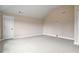 This spacious bedroom has carpet flooring and vaulted ceilings at 2400 Gants Hill Pl, Cumming, GA 30041