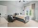 This bedroom features a ceiling fan, stylish decor, and a window letting in natural light at 2400 Gants Hill Pl, Cumming, GA 30041