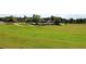 Picturesque golf course view with lush green fairways and mature trees, perfect for enjoying a round of golf at 2400 Gants Hill Pl, Cumming, GA 30041