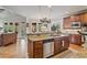 Open kitchen layout showcasing granite countertops, stainless appliances, and a cozy breakfast nook at 2400 Gants Hill Pl, Cumming, GA 30041