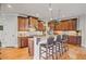 Charming kitchen featuring custom cabinets, stainless steel appliances, and an island with bar seating at 2400 Gants Hill Pl, Cumming, GA 30041