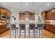 Beautiful kitchen with granite counters, stainless steel appliances, and bar seating at 2400 Gants Hill Pl, Cumming, GA 30041