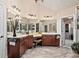 The bathroom is fitted with wooden cabinets, double mirrors, granite countertops, and tiled flooring at 2400 Gants Hill Pl, Cumming, GA 30041