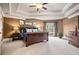 This main bedroom has an oversized bed, vaulted ceiling, and large windows that offer great views at 2400 Gants Hill Pl, Cumming, GA 30041